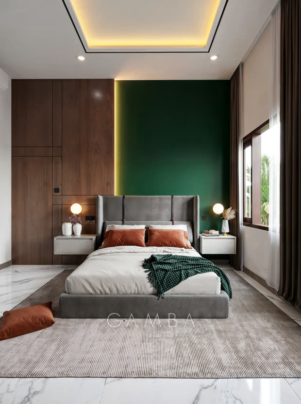 Render kamar tidur menghadap ranjang: dinding aksen hijau, panel kayu, bantal oranye